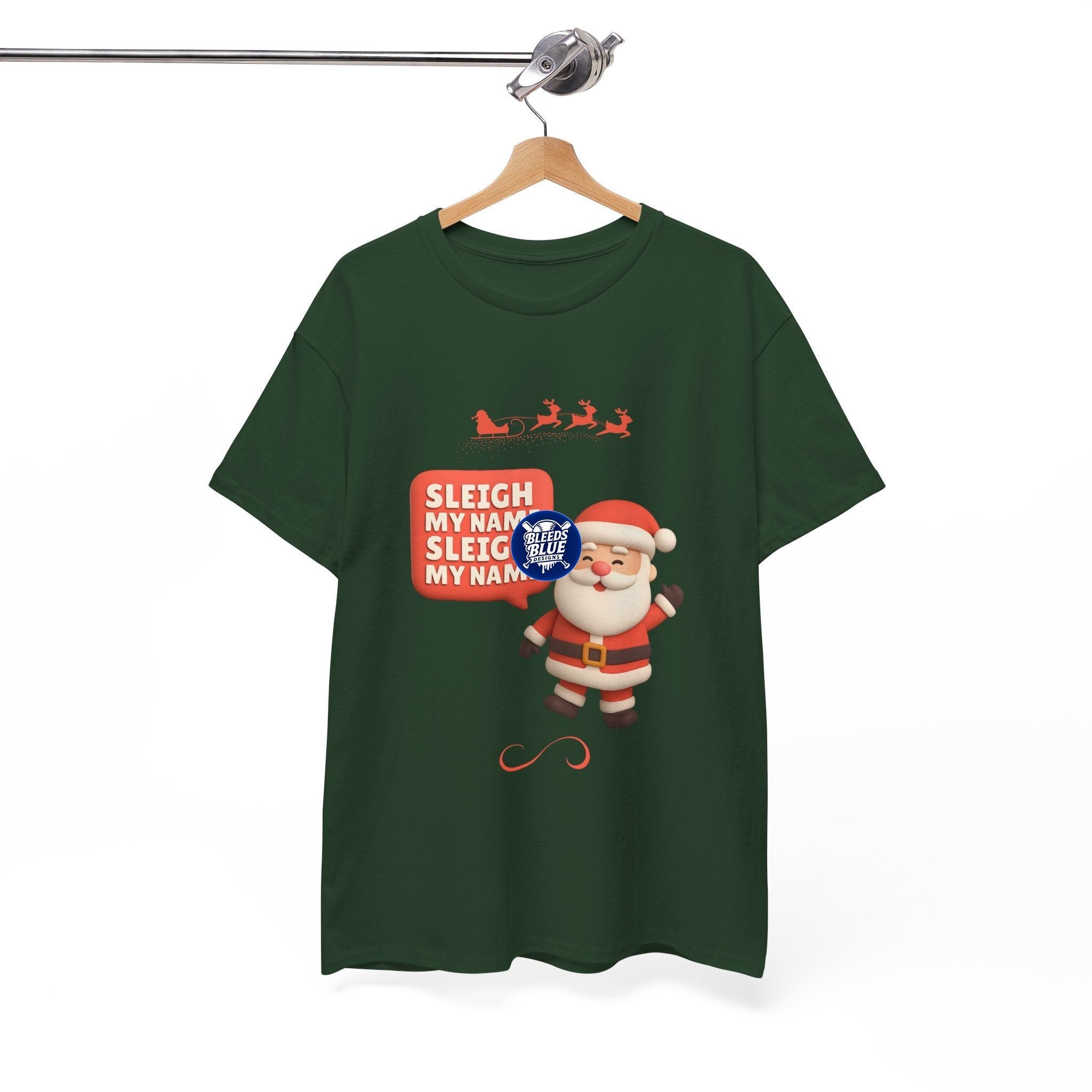Green t-shirt with Santa Claus graphic and 'Sleigh My Name' text on a hanger against a white background